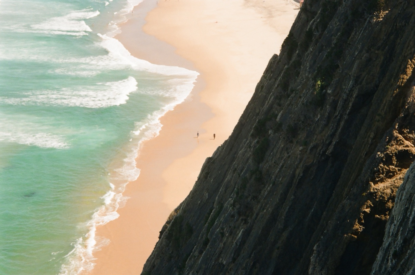 Aerial view of a dramatic coastline with turquoise water