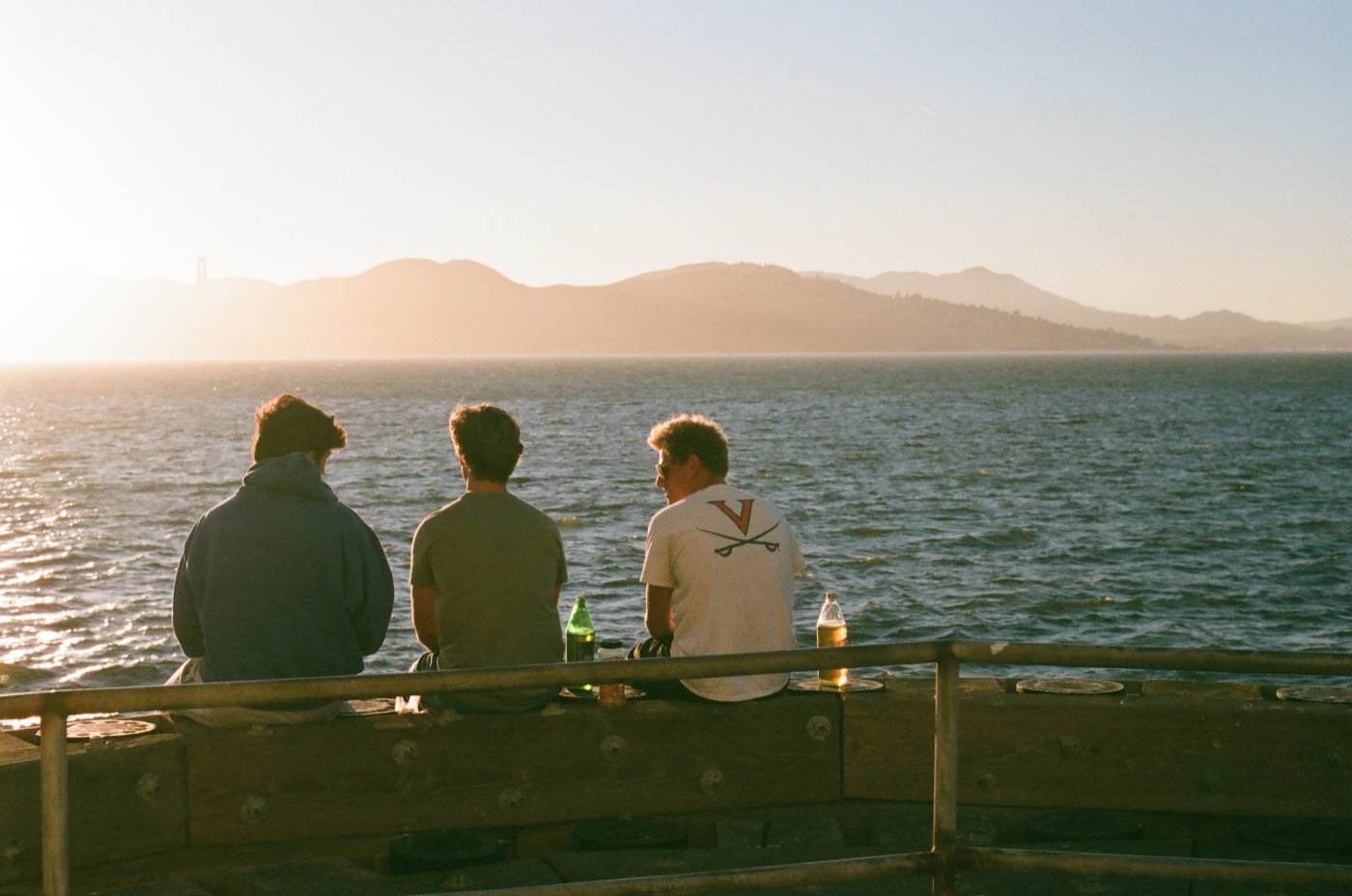 Friends at the waterfront during golden hour